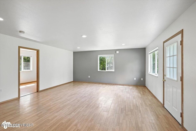 6710 W Joes Dr, Wasilla, AK 99623 - unfurnished room with light wood-style flooring, a smoke detector, and recessed lighting