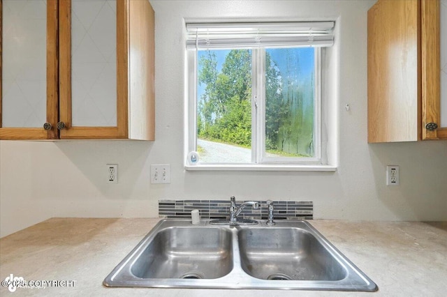 6710 W Joes Dr, Wasilla, AK 99623 - kitchen featuring light countertops and glass insert cabinets