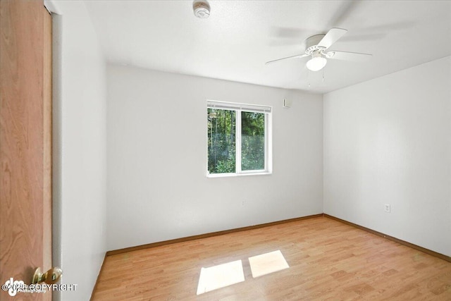 6710 W Joes Dr, Wasilla, AK 99623 - spare room with wood finished floors, a ceiling fan, and a smoke detector