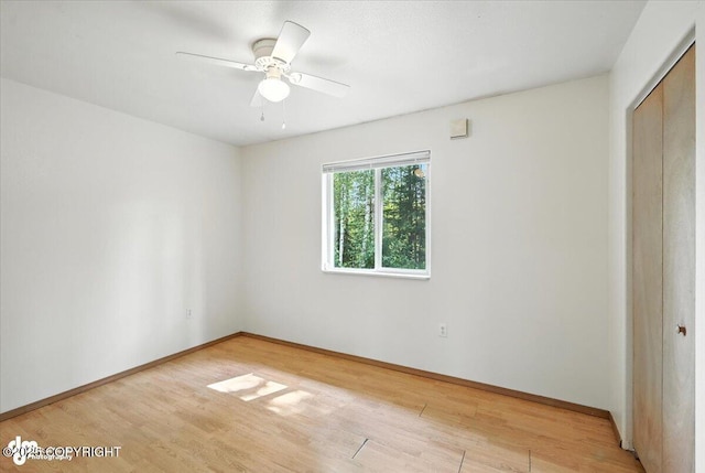 6710 W Joes Dr, Wasilla, AK 99623 - unfurnished bedroom with light wood-style floors, a closet, and ceiling fan