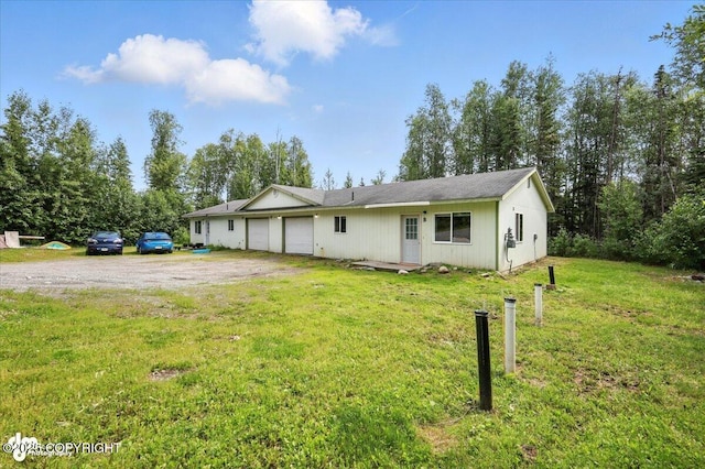 6710 W Joes Dr, Wasilla, AK 99623 - ranch-style home with a garage, a front lawn, and driveway