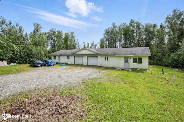 6710 W Joes Dr, Wasilla, AK 99623 - ranch-style house with a garage, driveway, and a front lawn