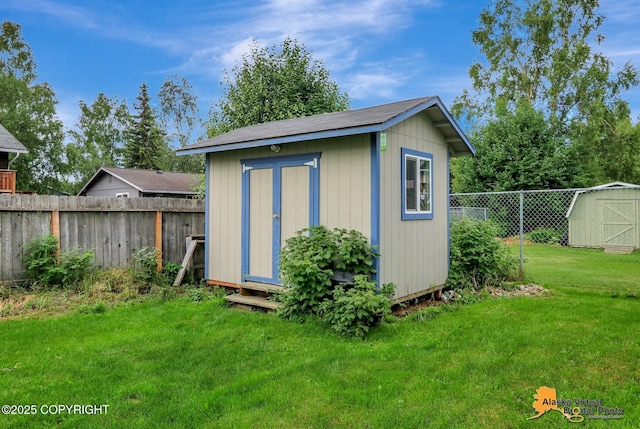 3306 E 19th Ct, Anchorage, AK 99508 - view of shed featuring a fenced backyard