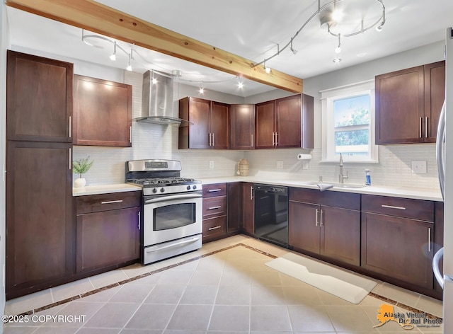 3306 E 19th Ct, Anchorage, AK 99508 - kitchen with black dishwasher, wall chimney range hood, stainless steel gas stove, track lighting, and light countertops
