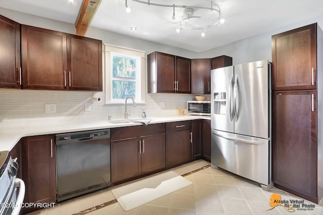 3306 E 19th Ct, Anchorage, AK 99508 - kitchen with stainless steel appliances, tasteful backsplash, light countertops, light tile patterned floors, and dark brown cabinetry