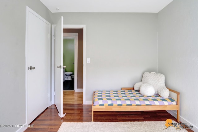 3306 E 19th Ct, Anchorage, AK 99508 - bedroom with wood finished floors and baseboards