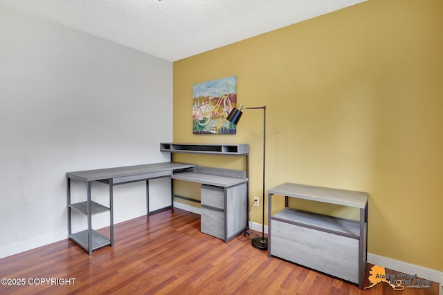 3306 E 19th Ct, Anchorage, AK 99508 - office space with wood finished floors and a textured ceiling