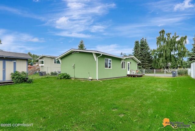 3306 E 19th Ct, Anchorage, AK 99508 - rear view of property featuring stucco siding