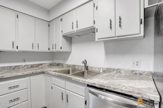 791 N Yakima St, Wasilla, AK 99654 - kitchen featuring stainless steel dishwasher, light countertops, and white cabinets