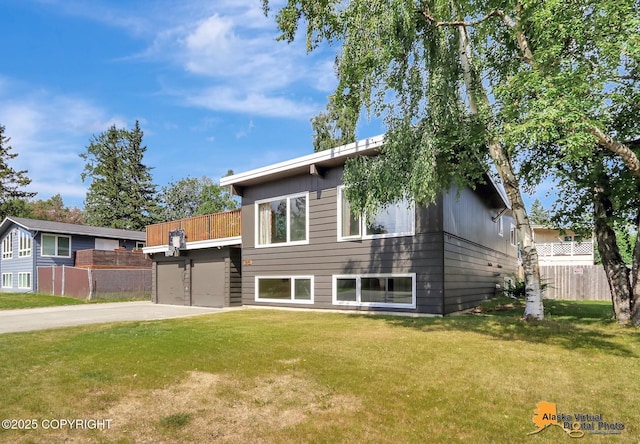 1915 Stanford Dr, Anchorage, AK 99508 - view of front facade with concrete driveway and a garage