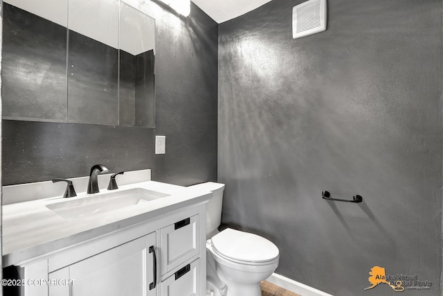 1915 Stanford Dr, Anchorage, AK 99508 - bathroom featuring vanity and a textured wall