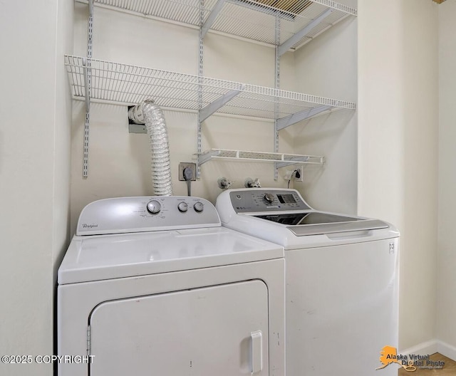 1915 Stanford Dr, Anchorage, AK 99508 - washroom featuring washer and clothes dryer
