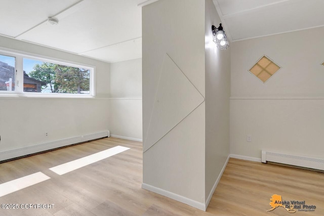 1915 Stanford Dr, Anchorage, AK 99508 - below grade area featuring wood finished floors and baseboard heating