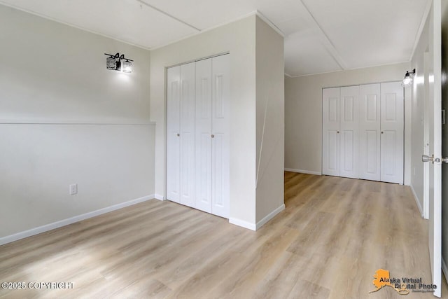 1915 Stanford Dr, Anchorage, AK 99508 - unfurnished bedroom with light wood-style flooring and baseboards