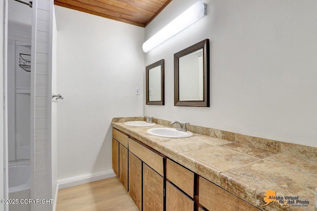 1915 Stanford Dr, Anchorage, AK 99508 - full bathroom featuring double vanity, wood ceiling, and wood finished floors