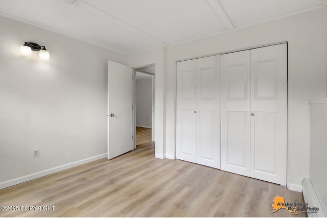 1915 Stanford Dr, Anchorage, AK 99508 - unfurnished bedroom with light wood-style flooring and a closet