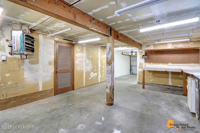 1915 Stanford Dr, Anchorage, AK 99508 - unfinished below grade area featuring a heating unit and a workshop area