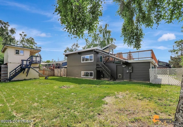 1915 Stanford Dr, Anchorage, AK 99508 - rear view of property with stairs and a deck