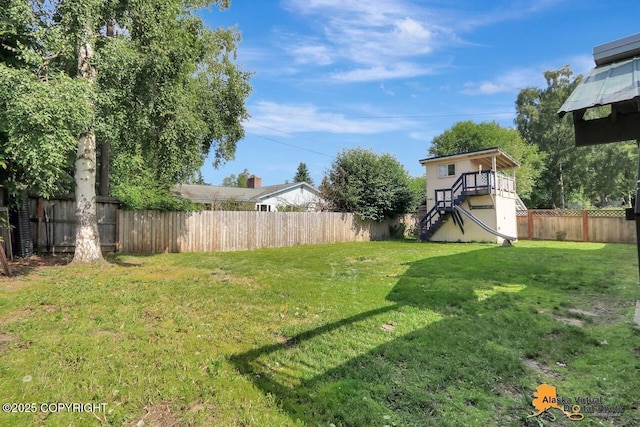 1915 Stanford Dr, Anchorage, AK 99508 - fenced backyard featuring stairway