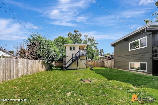 1915 Stanford Dr, Anchorage, AK 99508 - fenced backyard with stairs