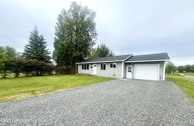 150 S Leibrock St, Soldotna, AK 99669 - ranch-style house featuring an attached garage, gravel driveway, and a front lawn