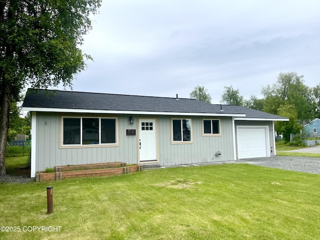 150 S Leibrock St, Soldotna, AK 99669 - ranch-style house with a garage, a front lawn, and gravel driveway