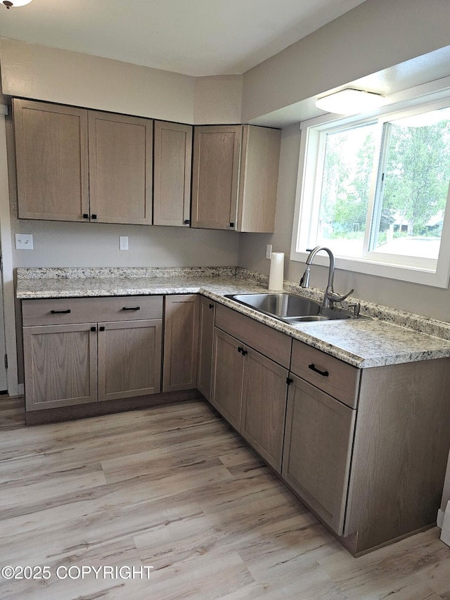 150 S Leibrock St, Soldotna, AK 99669 - kitchen with a sink and light wood-style floors