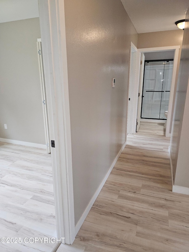 150 S Leibrock St, Soldotna, AK 99669 - hall with baseboards and light wood-style flooring