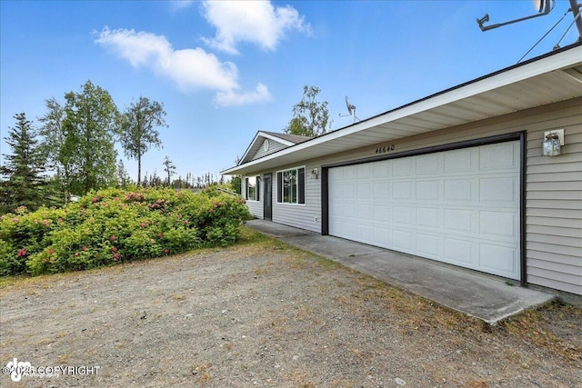 46640 Jo Ave, Kenai, AK 99611 - view of property exterior with a garage and driveway