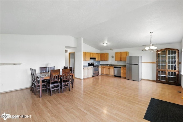 46640 Jo Ave, Kenai, AK 99611 - dining space with a chandelier, light wood-style flooring, and lofted ceiling