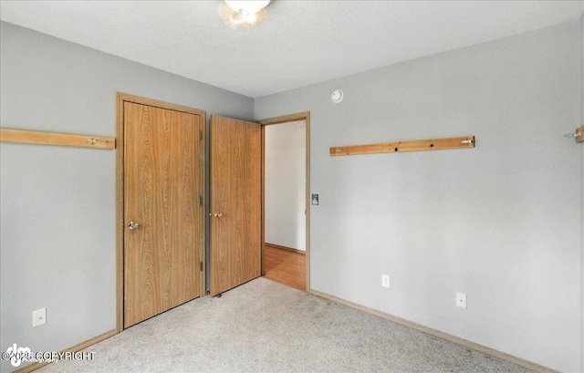 46640 Jo Ave, Kenai, AK 99611 - unfurnished bedroom featuring carpet and baseboards