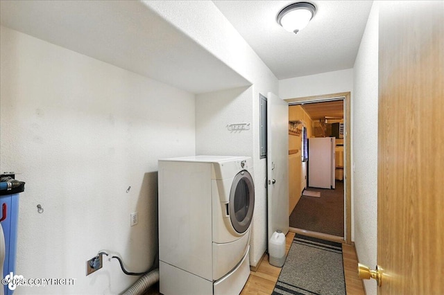 46640 Jo Ave, Kenai, AK 99611 - washroom featuring washer / clothes dryer and light wood finished floors