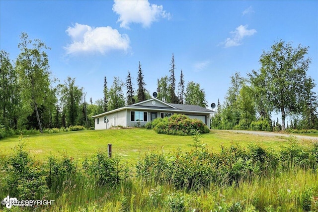 46640 Jo Ave, Kenai, AK 99611 - view of green lawn with an attached garage