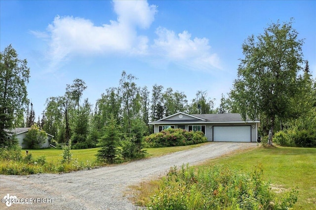 46640 Jo Ave, Kenai, AK 99611 - view of front of house featuring dirt driveway, an attached garage, and a front lawn