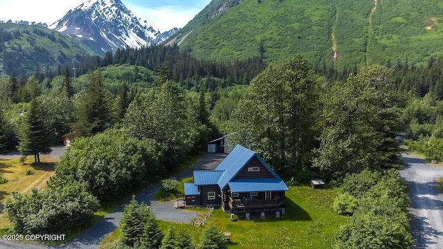2415 Afognak Ave, Seward, AK 99664 - aerial view of property and surrounding area with a heavily wooded area and a mountain backdrop