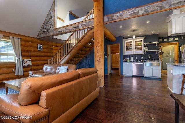 2415 Afognak Ave, Seward, AK 99664 - living area featuring rustic walls, high vaulted ceiling, wet bar, dark wood finished floors, and stairway