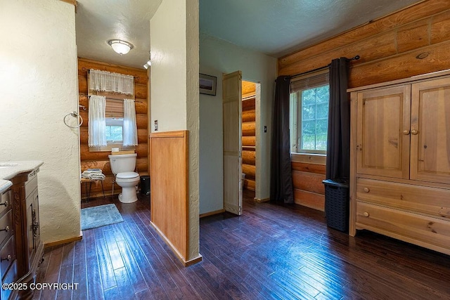 2415 Afognak Ave, Seward, AK 99664 - bathroom with vanity, hardwood / wood-style flooring, and log walls