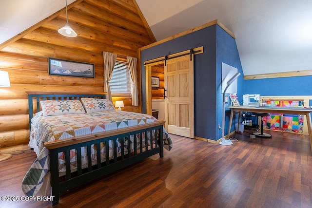 2415 Afognak Ave, Seward, AK 99664 - bedroom featuring lofted ceiling, a barn door, wood finished floors, and rustic walls
