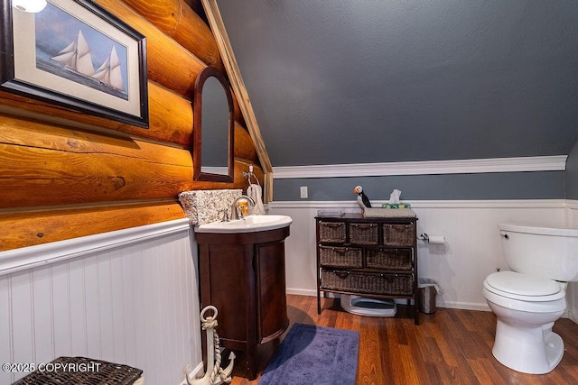 2415 Afognak Ave, Seward, AK 99664 - half bathroom featuring vanity, wood finished floors, and a wainscoted wall