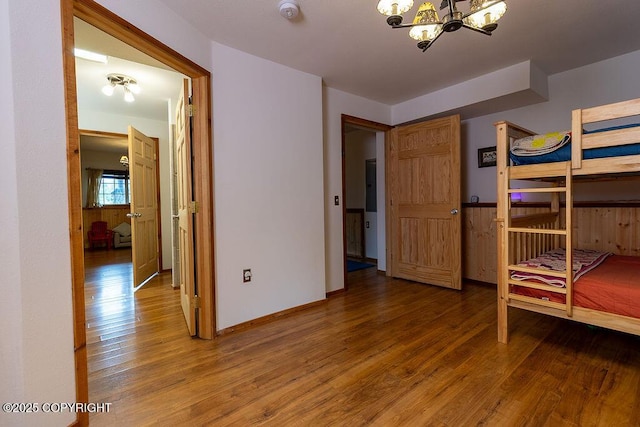 2415 Afognak Ave, Seward, AK 99664 - unfurnished bedroom with a chandelier and wood finished floors
