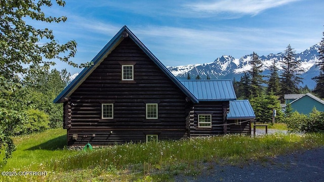 2415 Afognak Ave, Seward, AK 99664 - view of side of property featuring log siding, a mountain view, and a metal roof