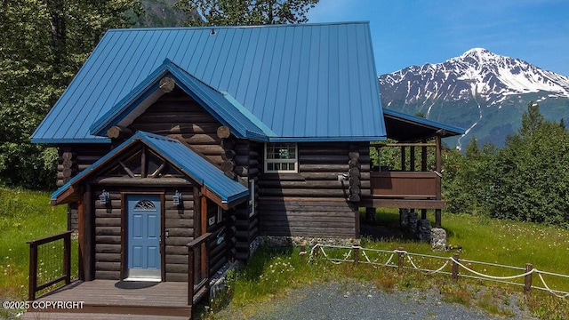 2415 Afognak Ave, Seward, AK 99664 - log-style house with log siding, a mountain view, and a metal roof