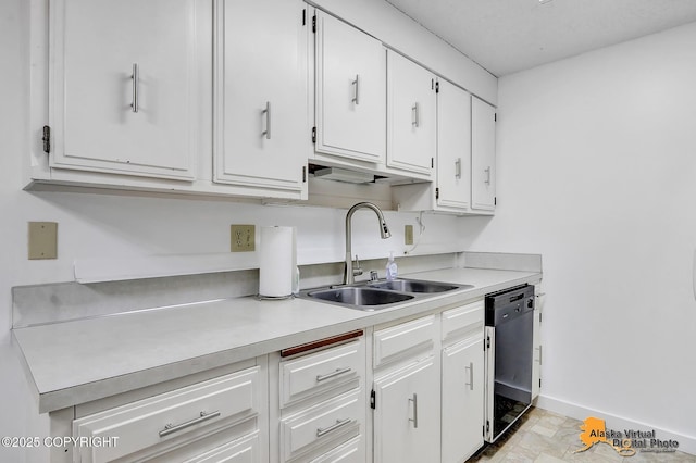3958 Reka Dr Unit A-2, Anchorage, AK 99508 - kitchen with light countertops, white cabinetry, and black dishwasher