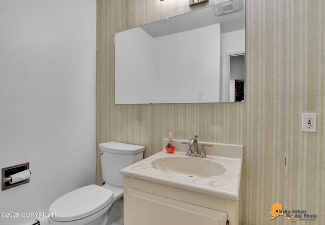 3958 Reka Dr Unit A-2, Anchorage, AK 99508 - half bath with wallpapered walls and vanity