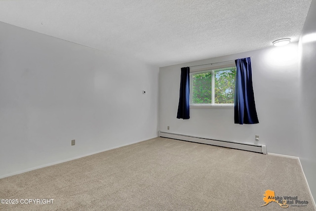 3958 Reka Dr Unit A-2, Anchorage, AK 99508 - empty room with a baseboard heating unit, carpet, and a textured ceiling