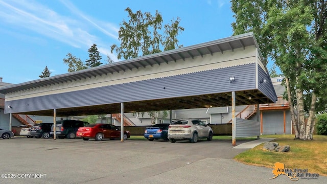 3958 Reka Dr Unit A-2, Anchorage, AK 99508 - covered parking lot featuring stairway