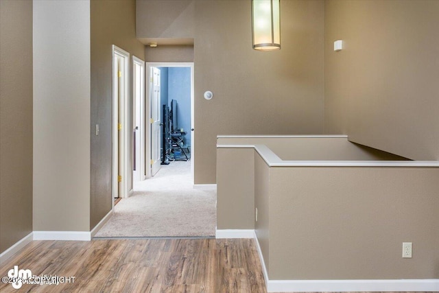 18644 Eaglewood Loop, Eagle River, AK 99577 - corridor featuring wood finished floors and an upstairs landing