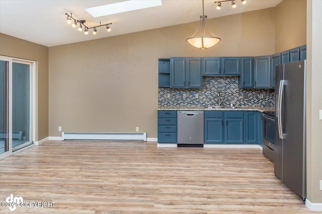 18644 Eaglewood Loop, Eagle River, AK 99577 - kitchen with appliances with stainless steel finishes, a baseboard heating unit, a skylight, rail lighting, and light wood-style flooring