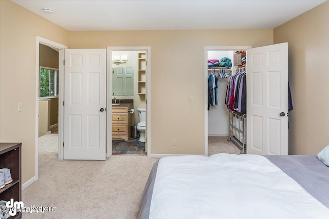 18644 Eaglewood Loop, Eagle River, AK 99577 - bedroom with light carpet, a spacious closet, a closet, and ensuite bath