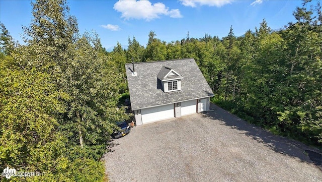 2436 N Hope Cir, Palmer, AK 99645 - view of side of home featuring a garage and a view of trees